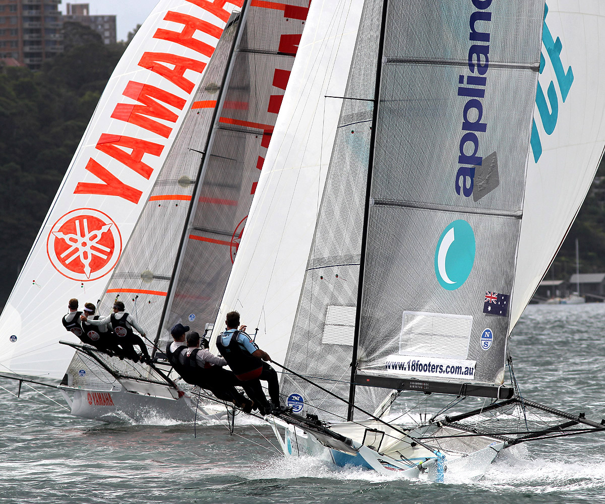 Yamaha and appliancesonline in a tight spinnaker battle as they head for the bottom mark